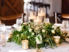 Guest Table with Greenery and Flowers and Cylinders with Candles