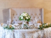 Sweetheart Table with Bridal Bouquet, Greenery, and Mr. and Mrs. Sign