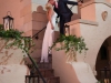 Bride and Groom on Stairs with Greens
