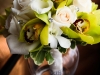 Bridal bouquet of green orchids, callas, and roses