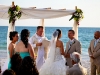 Bride and Groom under Bamboo Beach Canopy