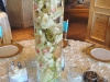 Submerged green orchids wedding centerpiece with rose cubes