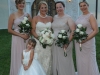 Bride with Bridesmaids and their Bouquets and Flower girl