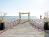 Beach Ceremony with Bamboo Driftwood Arch Manzanita Back of Aisle