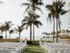 White Columns with White Flowers to Frame Couple at Ceremony