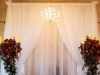Silver Candelabras with Flowers and Greens to Frame Ceremony Site