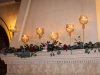Mantle with Gold Candle Holders with Greens and Roses