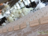 Place card table with low spray roses hydrangea and orchids