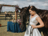 Bride with Horse and Sweetheart Table in Background