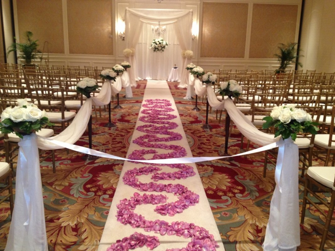 wedding aisle with flower petal scroll design