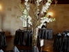 vase of curly willow with white dendrobium orchids