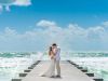 Bride and Groom on Dock with Water Background