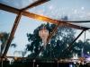 Sparkling Chandelier inside Clear Wedding Tent