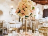 Gorgeous Guest Table Centerpiece featuring Gold Candelabra with Topiary of Hydrangea, Pink Mondial Roses, and Playa Blance White Roses with a Wreath at Base To Match