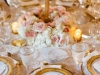 Close-up of wreath at the base of the gold candelabra guest table centerpiece