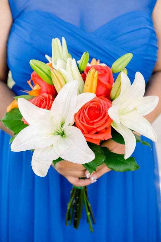 Blue Bridesmaid's Gown with Deep Coral and Orange Bridesmaid's Bouquet