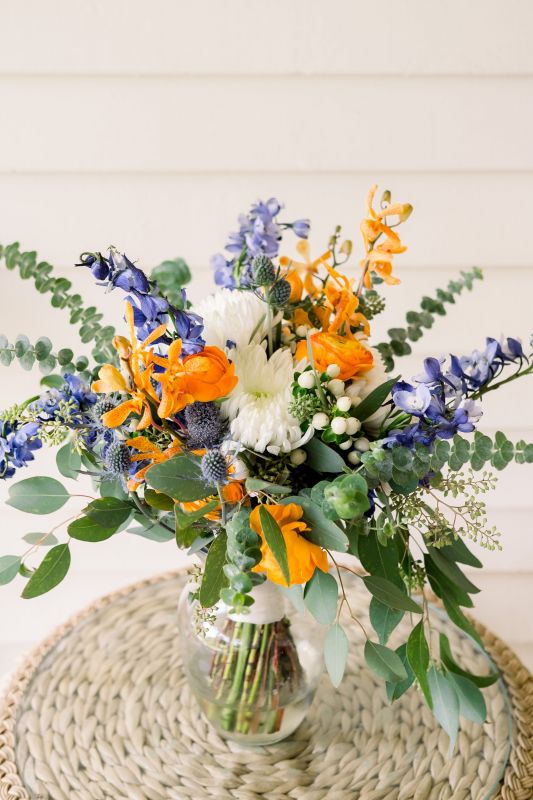 Garden-look Bridal Bouquet in Orange, Creams, and Blues