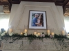 Mantle at Powel Crosley with Photograph, Candles, and Flowers