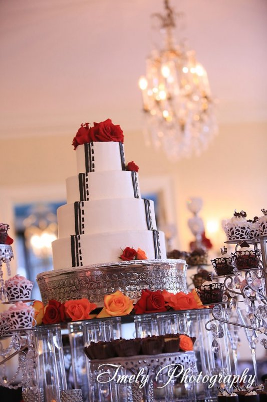 Black and white bridal cake with red roses
