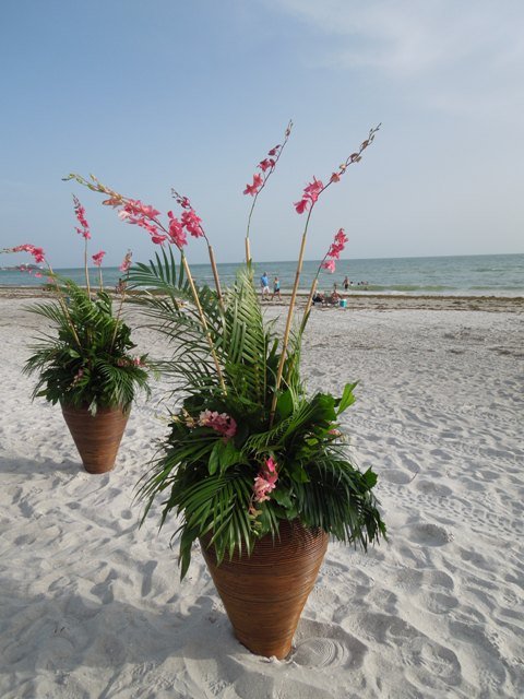 bamboo-vases-with-palms-and-orchids