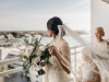 Bride with All-White Bouquet on Balcony
