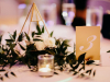 Guest Table Centerpiece with Gold Geometric Holder with Roses and Greenery