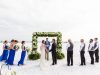 Ceremony Site on the Beach with Lush Greens and Florals